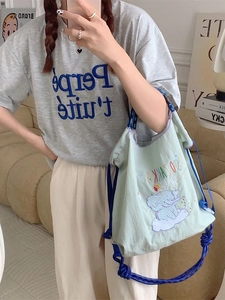 Cute green elephant embroidery tote bag with blue rope straps for casual daily use