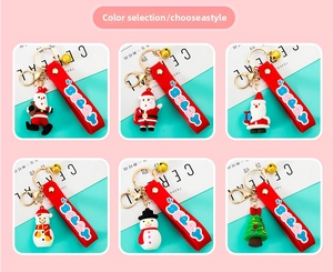 Collection of Christmas Santa and Snowman soft PVC keychains with colorful silicone wrist straps