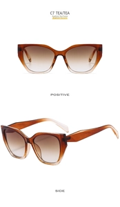 Detail view of retro cat-eye sunglasses with tea gradient lenses and metal hinges