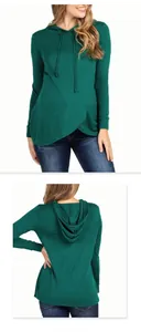 Front and back view of a dark green maternity hoodie featuring a stylish cross hem design
