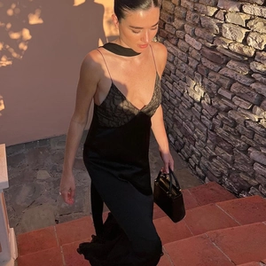 Elegant black lace patchwork slip dress featuring mesh hem and slim fit design