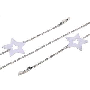Close-up of silver metal eyewear chain with white translucent acrylic star charms
