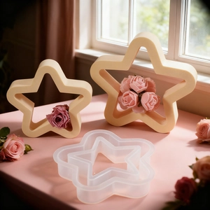 Star-shaped silicone mold for DIY resin crafts with finished rounded five-point star ornaments