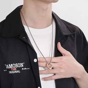 Hip-hop layered square pearl necklace with crystal pendant shown on black shirt