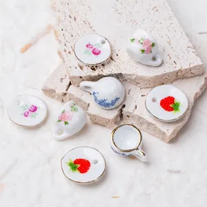 Miniature ceramic tea cup and saucer set with floral patterns for jewelry DIY and dollhouse