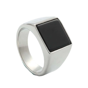 Detailed 45-degree angle of a silver stainless steel signet ring with a black square gem