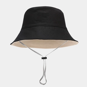 Detail view of foldable canvas bucket hat with adjustable windproof grey chin strap cord