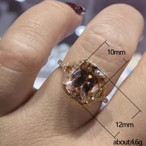 Rose gold engagement ring with champagne cushion-cut zircon worn by a model
