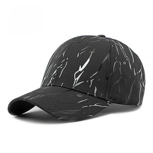 Close-up of black baseball cap with white marble texture and six-panel street style design