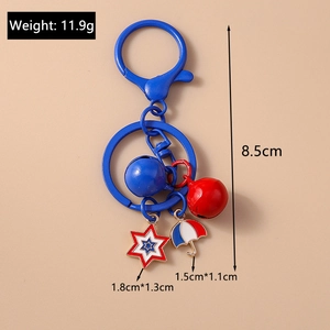 Detail view of star and umbrella keychain charms showing weight and size measurements
