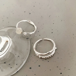 Detail of silver branch ring with moonstone and double-layer vintage textured band