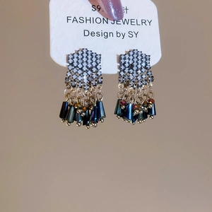 Detailed shot of S925 silver needle drop earrings with blue crystal fringe and zircons