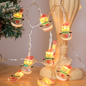 LED snowman fairy lights with warm glow wrapped around a Christmas tree for holiday decor