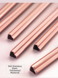 Macro detail of rose gold heart-shaped 304 stainless steel straw with a thick metal texture