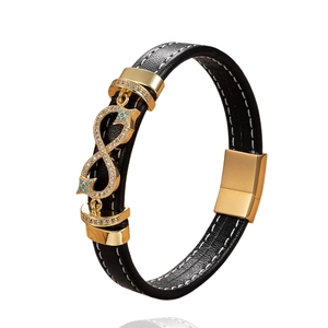 Black leather bracelet for men featuring golden infinity charm with blue crystals