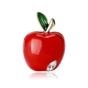 Elegant red apple brooch with gold leaf and crystal on a professional white background