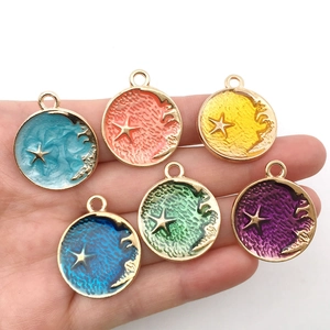 Set of 6 colorful alloy enamel star and moon charms held in hand for jewelry DIY