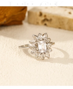 Detailed view of S925 silver flower ring with rectangular and pear-cut zircon stones