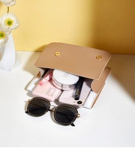 Interior view showing the large capacity of the beige PU leather flap bag with daily essentials