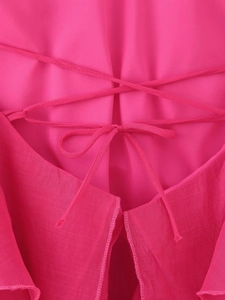 Detail of rose red summer dress back with adjustable criss-cross lace-up bow design