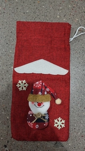 Detail of red burlap Christmas wine bottle bag with 3D snowman and snowflake accents