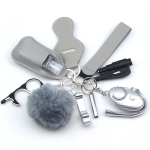 Gray neoprene safety keychain set with personal alarm and leather sanitizer holder