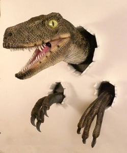 Detailed resin raptor wall decor showing realistic skin texture and breaking wall effect