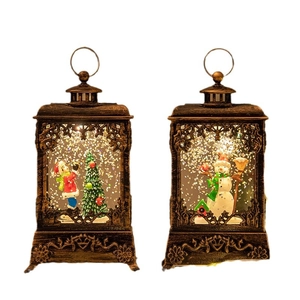 Bronze Christmas lanterns with glowing snowman and holiday tree decorations inside