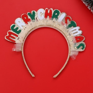 Detailed shot of Christmas headband with Merry Christmas letters and tulle on red background
