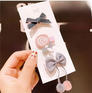 Three-piece fabric hair clip set for girls with bowknot and lollipop designs on card