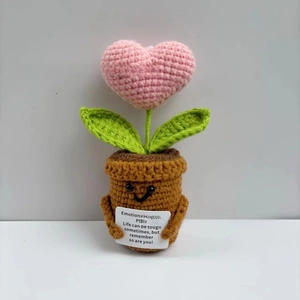 Detail of handmade crochet heart plant with an emotional support inspirational card