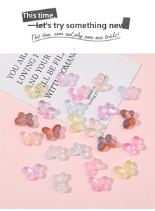 Macro detail of translucent butterfly charms with textured wings for DIY jewelry