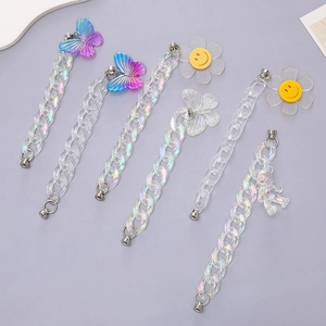 Close-up of colorful acrylic chains with butterfly and bear charms for phone cases