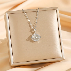 Titanium steel planet necklace with cat eye stone and micro diamonds on gold velvet