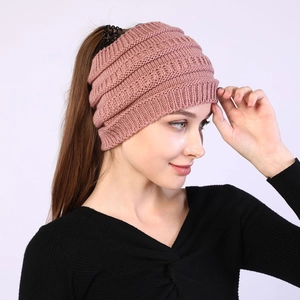 Detail of dusty pink knit ponytail headband showing texture and open top for long hair