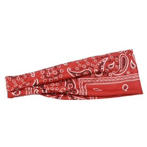 Detail of red paisley sports headband showing high-elastic fabric and twisted design