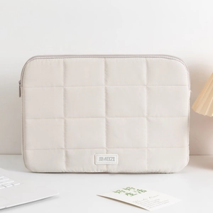 Detailed macro view of quilted laptop sleeve texture and premium JIMEIZI leather tag