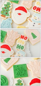 Macro shot of detailed icing on Christmas themed cookies with Santa and reindeer shapes
