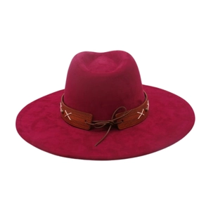 Detail of wide brim rose red felt hat featuring dark brown decorative band with white cross stitching