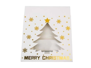 Detail showing white Christmas gift box with gold foil snowflakes and tree cutout
