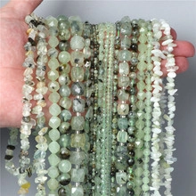Detailed close-up of natural white crystal faceted beads and irregular crushed stone held in hand
