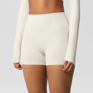 Detail of high-waist yoga shorts in beige showing tummy control and seamless design