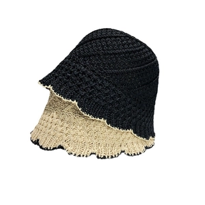 Handmade woven bucket hat in black and beige contrast for summer sun protection