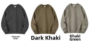 Flat lay of loose-fit crewneck sweatshirts in charcoal, dark khaki and khaki green