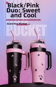 Close-up of 40oz tumblers with ergonomic handles and straws in matte black and pink design