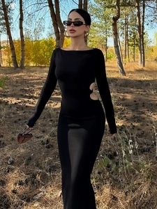 Elegant black long-sleeve maxi dress with side cut-outs and chic off-shoulder neckline