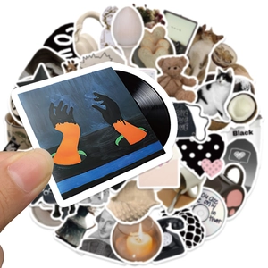 Close-up of waterproof cartoon vinyl record sticker with cute aesthetic doodles in background