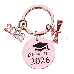Rose gold Class of 2026 graduation keychain with graduate scroll and charm charms