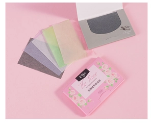 Detailed flat lay of 100-sheet rose and bamboo charcoal oil absorbing tissue packs