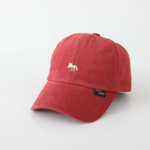 Close-up of red washed cotton baseball cap featuring detailed white fox embroidery